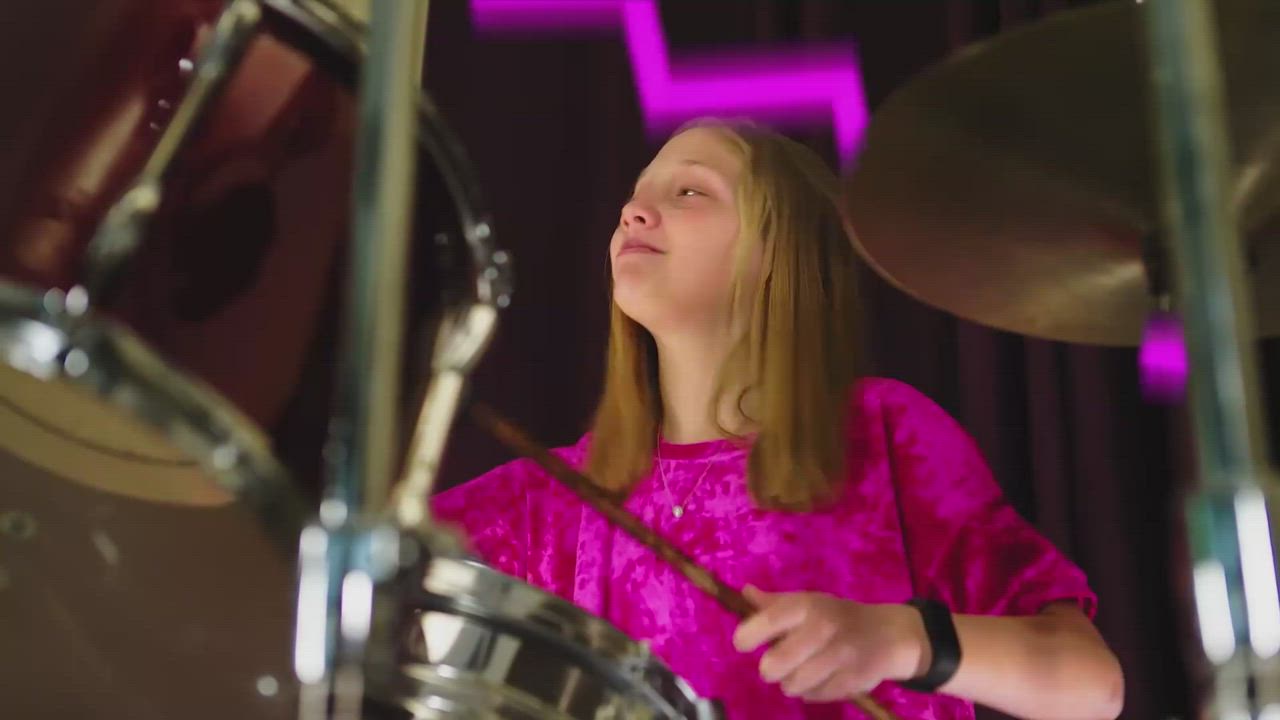 Teen playing drums